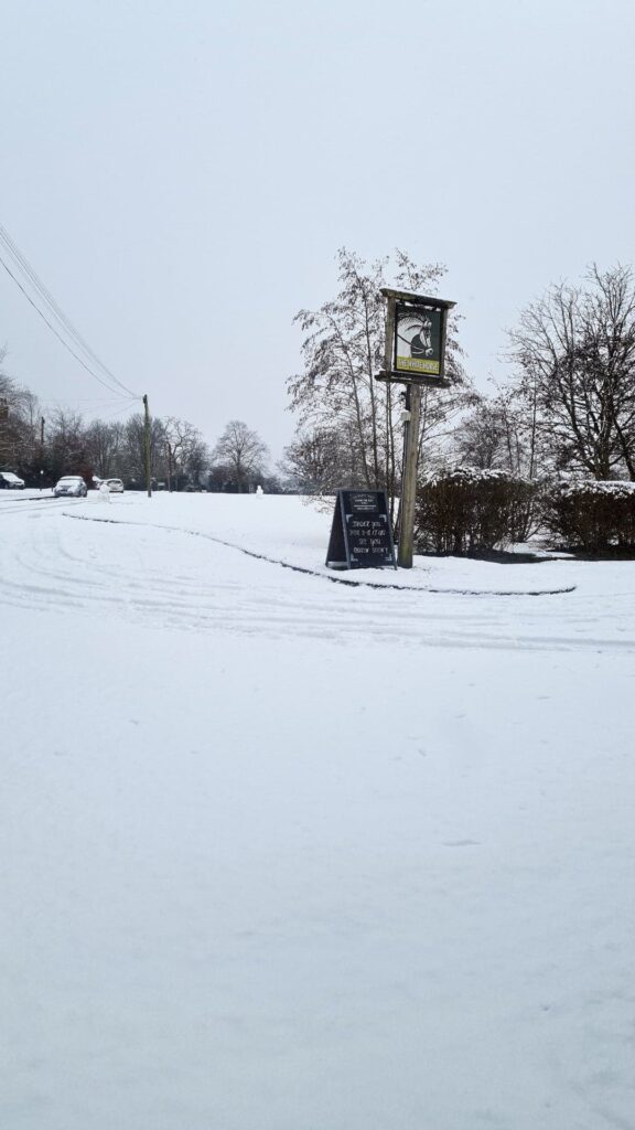 Christmas: Snow at the White Horse Pub